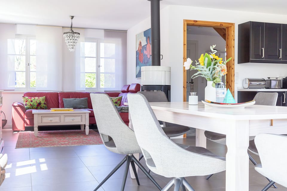 Living Room with Red Sofa and Dining Table