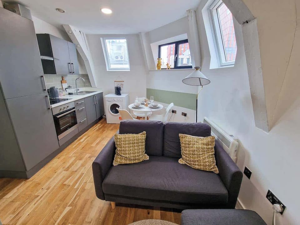 Loft-style skylights fill the living space with light while you relax on the comfy sofa