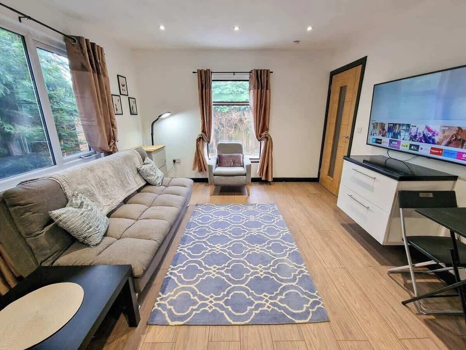 Large screen TV for movie nights in, with plenty of room to stretch out and relax