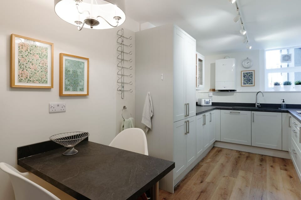 A fully equipped kitchen with comfortable seating