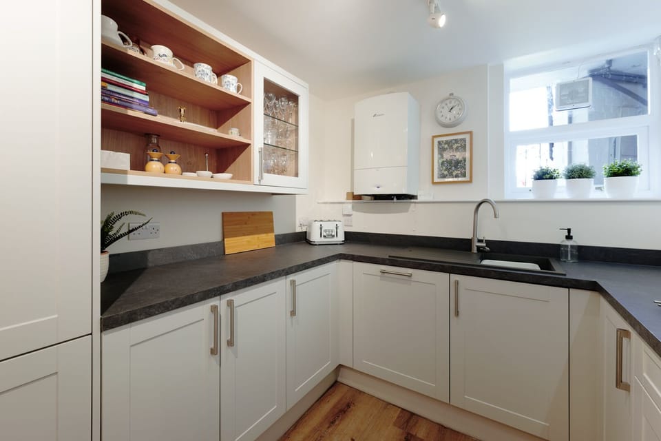 A fully equipped kitchen with comfortable seating