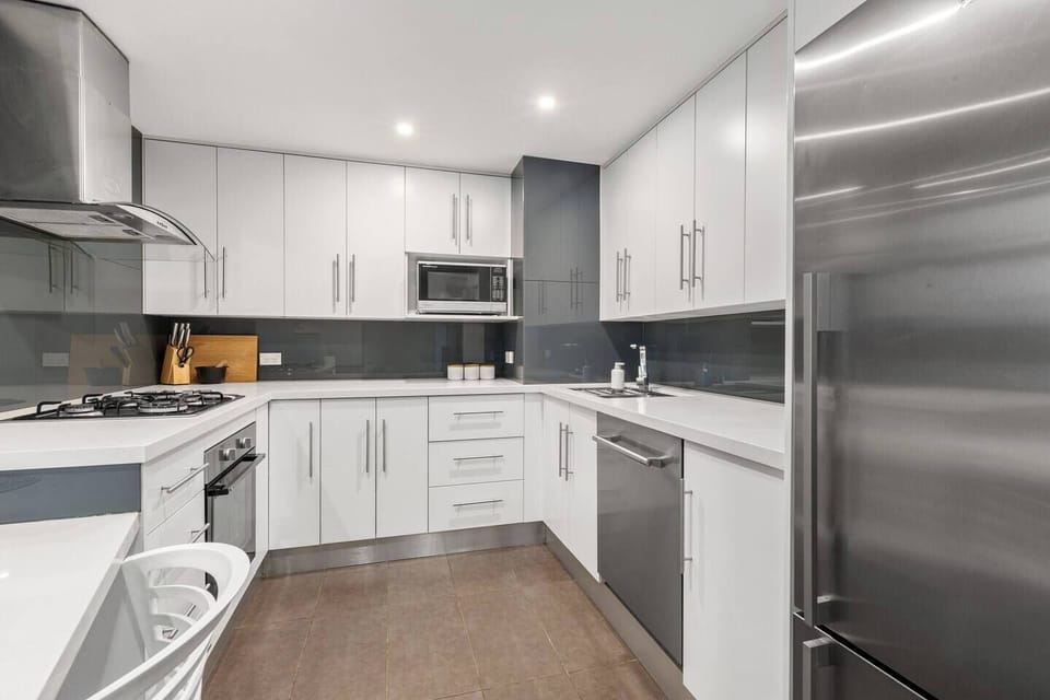 Cook comfortably in the sleek modern kitchen, where modern appliances and ample storage make everything from quick breakfasts to late-night dinners feel effortless.