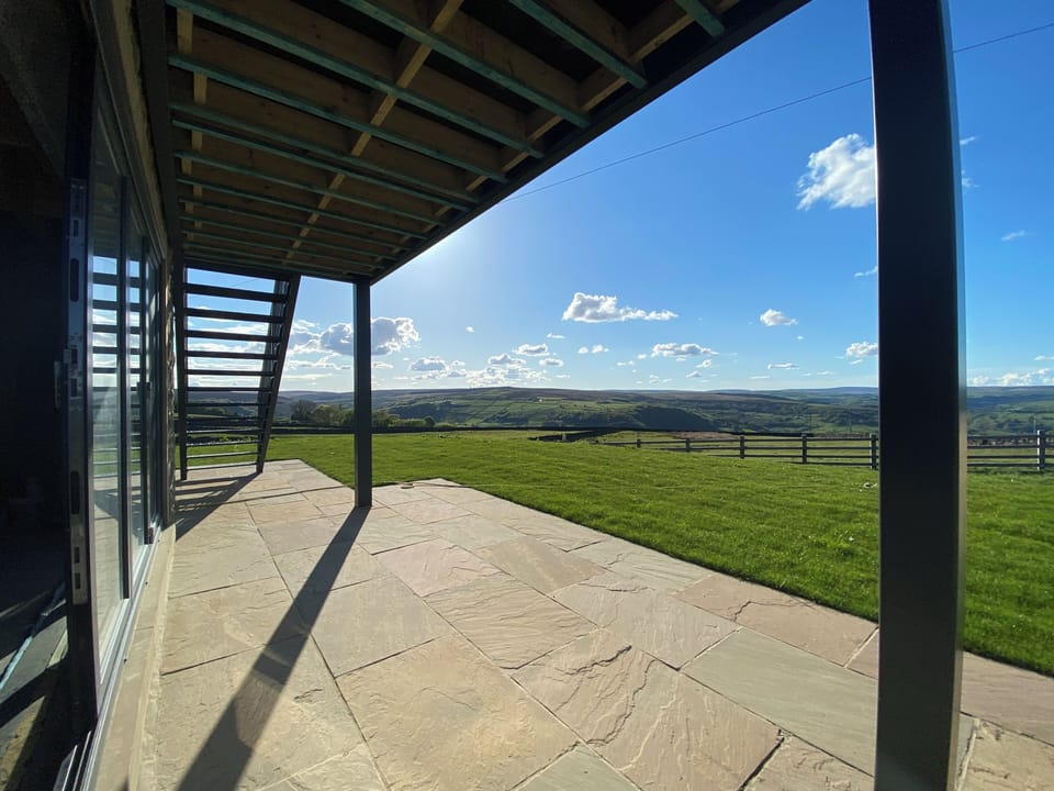 Patio, lawn and views over Cragg Vale towards Stoodley Pike