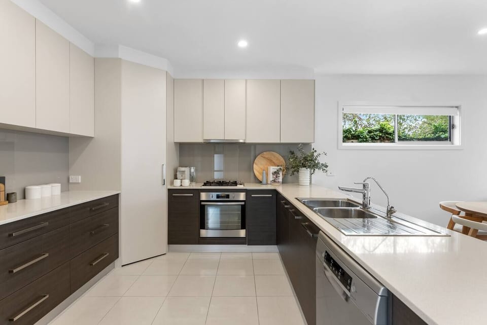 Prepare everything from quick beach breakfasts to family dinners in the sleek kitchen, complete with generous bench space and quality appliances.