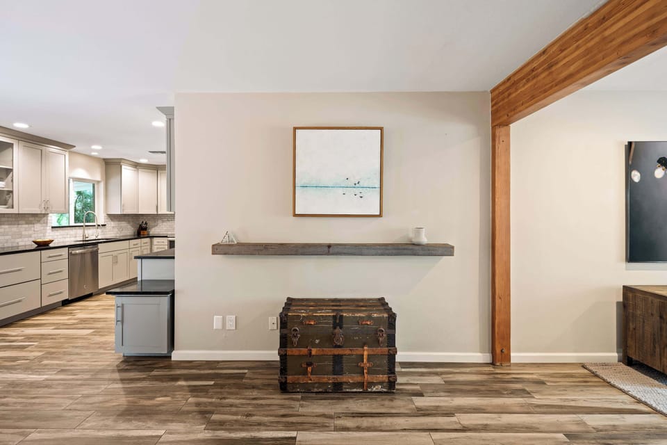 Bright and open living area featuring cozy furnishings and a smart TV.