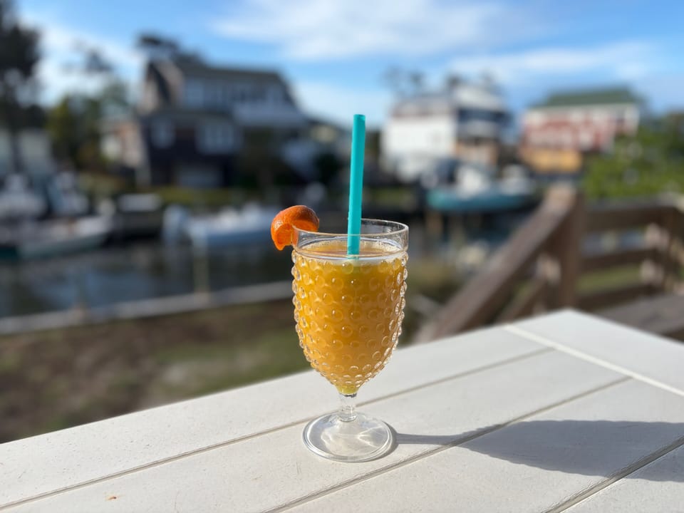 Three covered porches provide plenty of space to relax & enjoy the OBX sunshine.