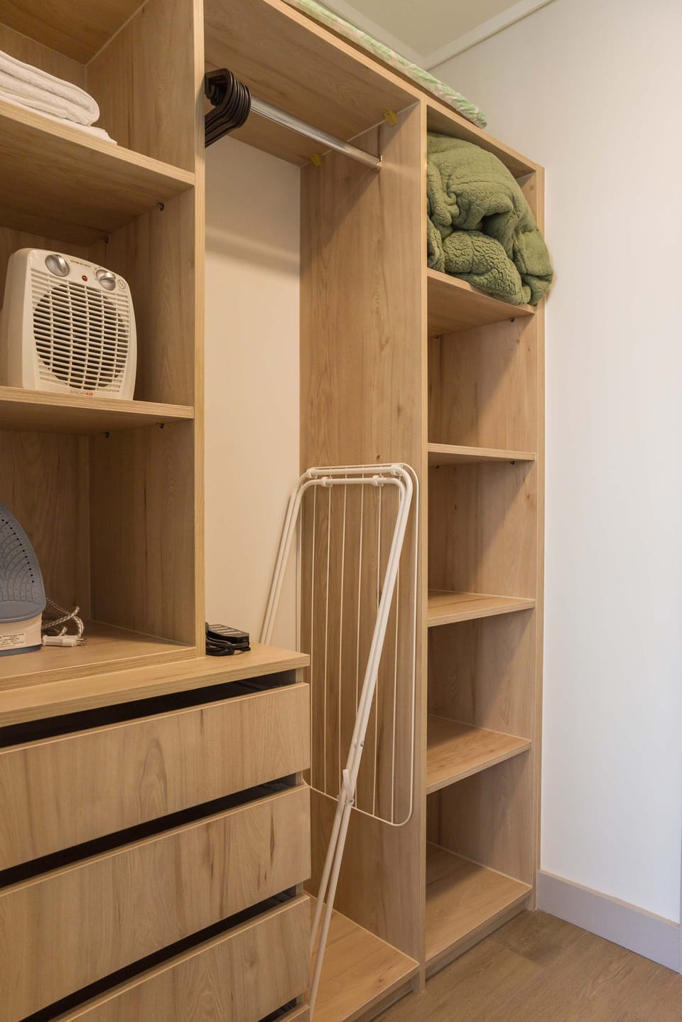 Organized storage space with essential amenities for a comfortable stay.
