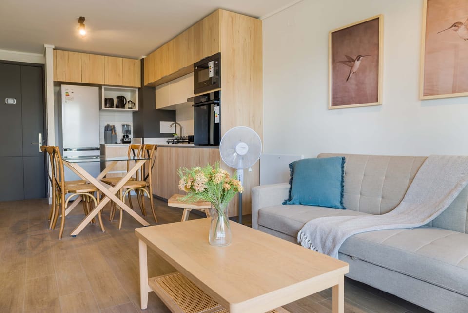 Cozy and modern studio with a fully equipped kitchen and stylish living area, perfect for a relaxing stay.