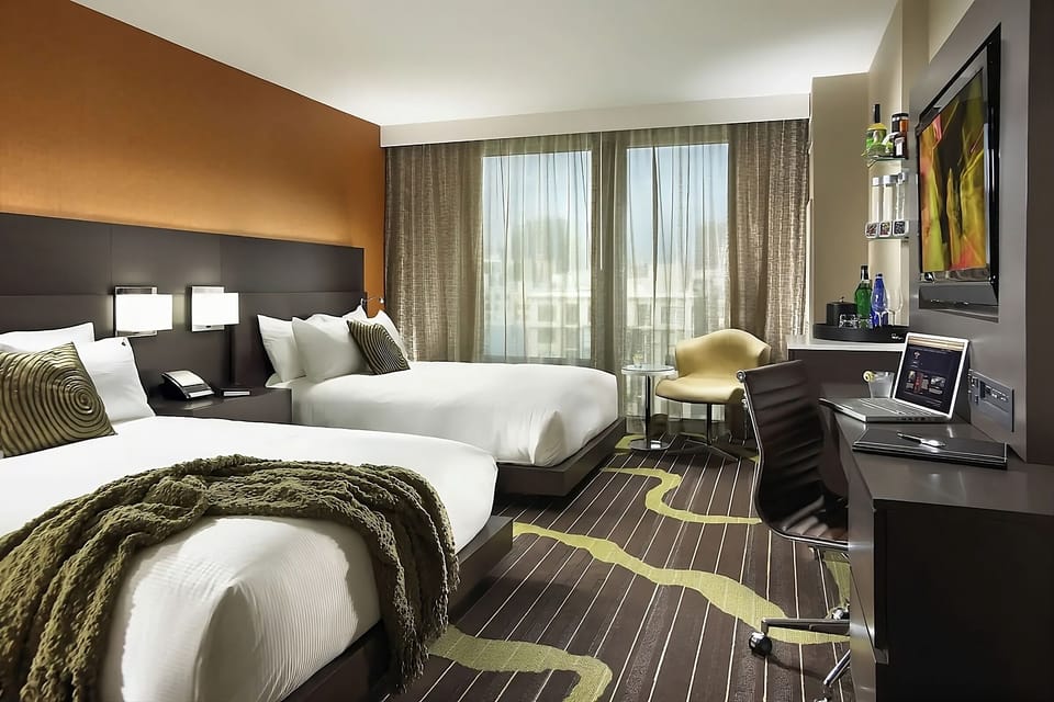 Spread out comfortably with two plush beds and bright workspace.