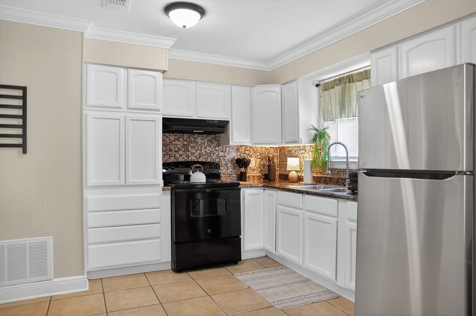 Full kitchen for preparing meals when not dining out at Ocean Springs hotspots 