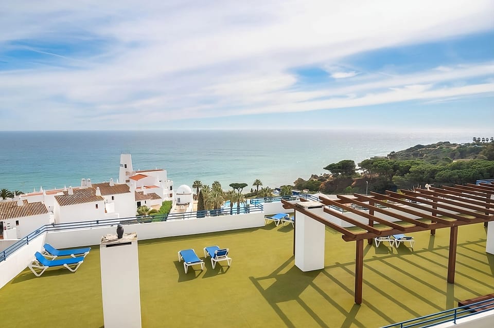 Linger on the rooftop terrace under soft coastal skies.