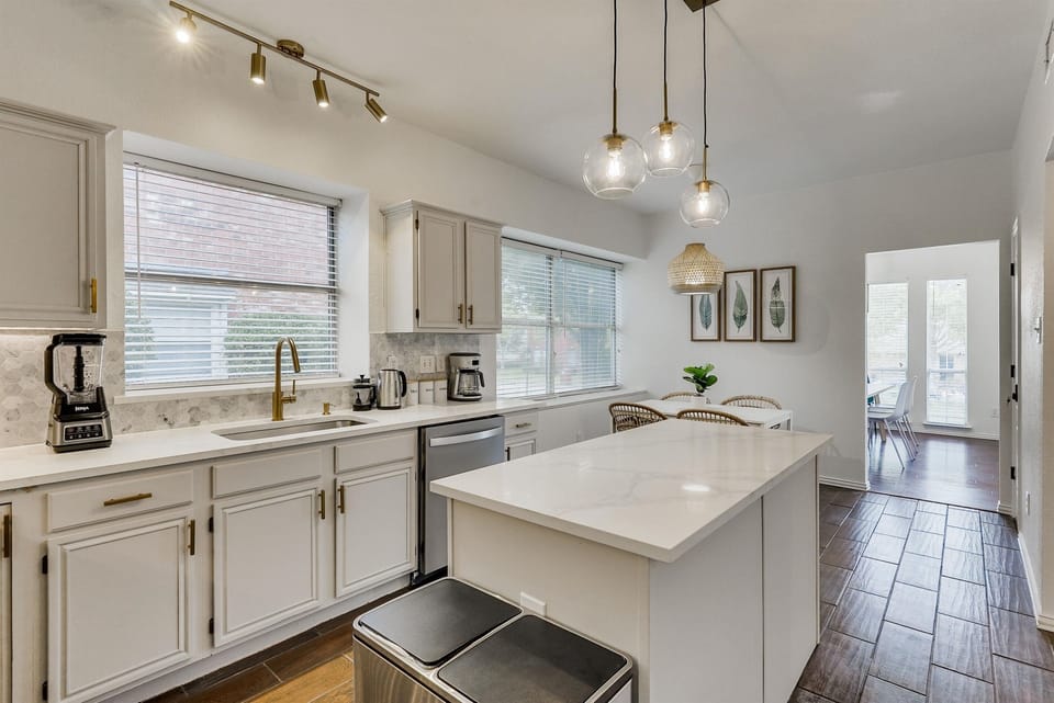 A bright and functional kitchen layout that blends comfort and efficiency, perfect for everything from morning coffee to evening meals.
