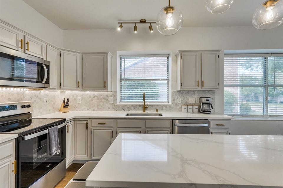 A polished kitchen space with clean lines and modern touches, designed to inspire culinary creativity and effortless entertaining.
