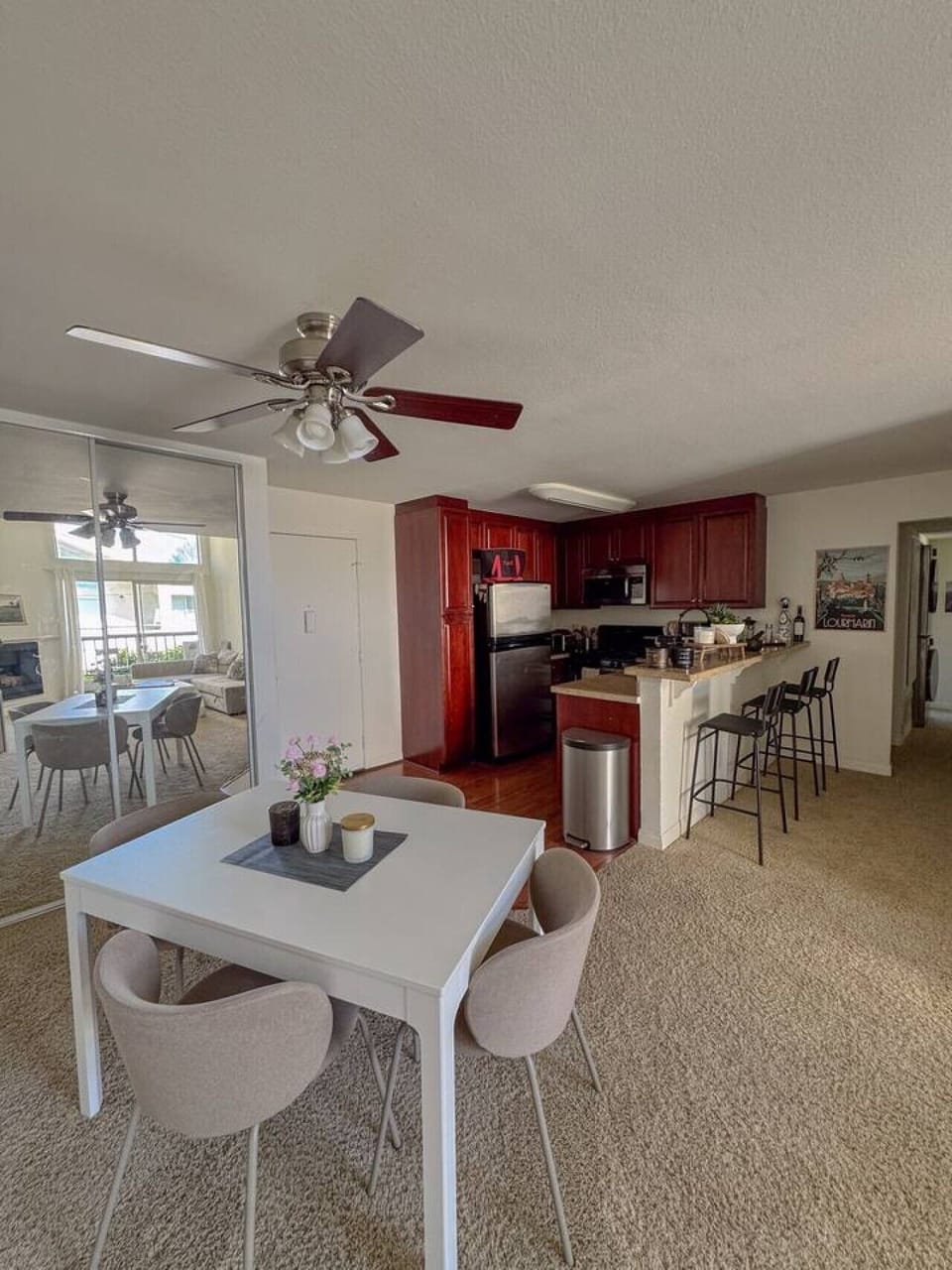 Fully equipped kitchen with breakfast bar seating for three and a dining table for four, great for cooking in during longer stays.