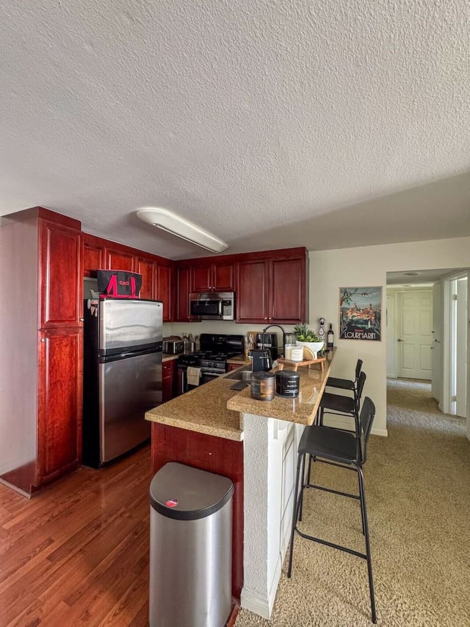 Spacious kitchen with rich cabinetry, full appliances, and a layout that works well for cooking and entertaining during longer stays.