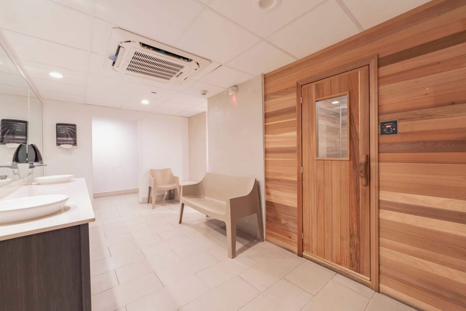 🔥 Relax & unwind in our modern sauna. The perfect spot to detox, recharge & enjoy a spa-like experience steps from your studio. #WellnessAmenity #Relaxation