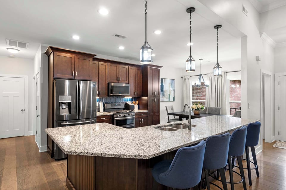 The heart of the home — a fully equipped kitchen with a large island perfect for meals, coffee, and conversation.