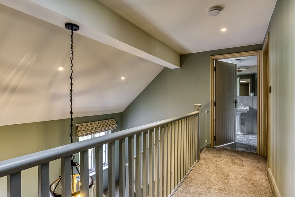 The first floor landing, leading to the family shower room