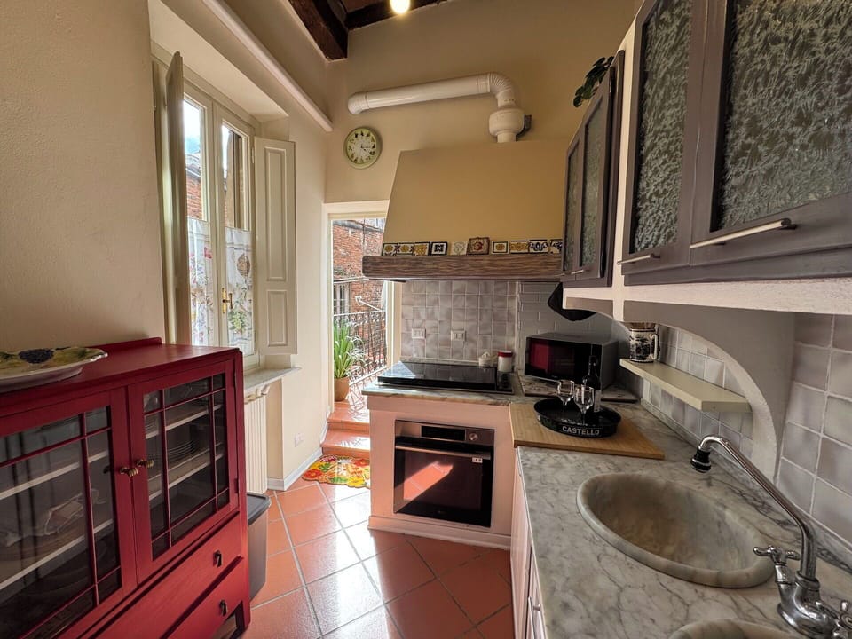 Kitchen, Countertop, Kitchen Appliance, Major Appliance, Flooring, Furniture, Interior Design, Wood, Floor, Cabinetry