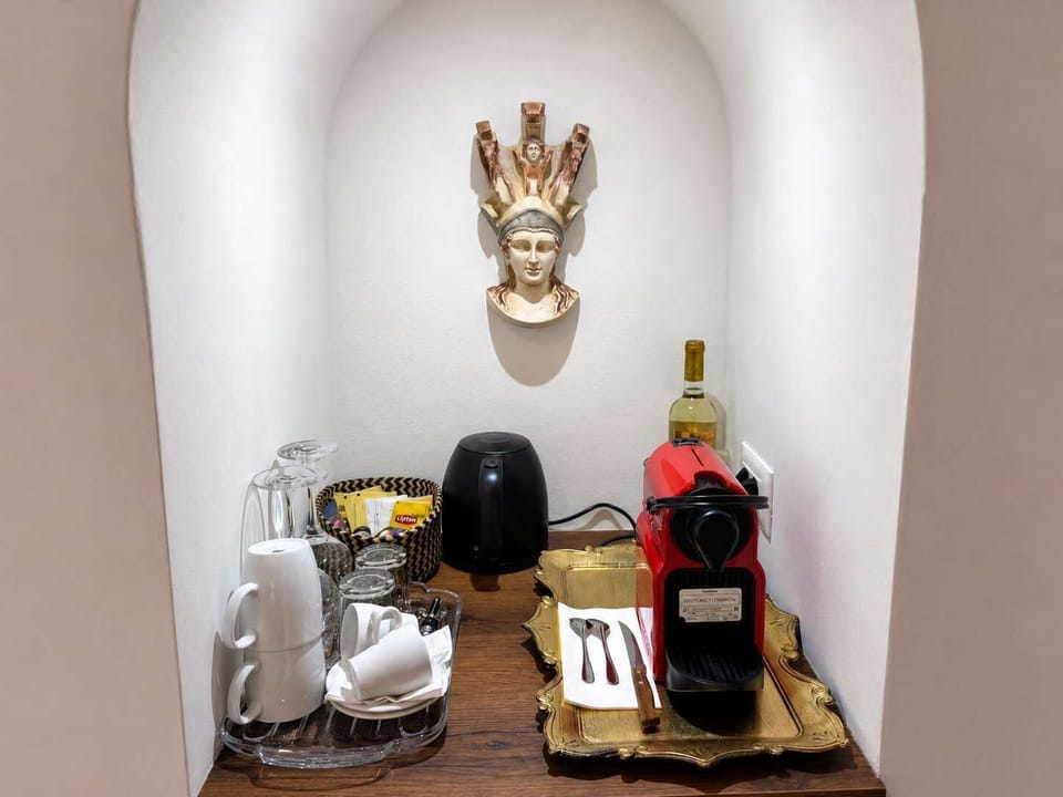 Coffee corner with machine, kettle, and essentials provided for added comfort