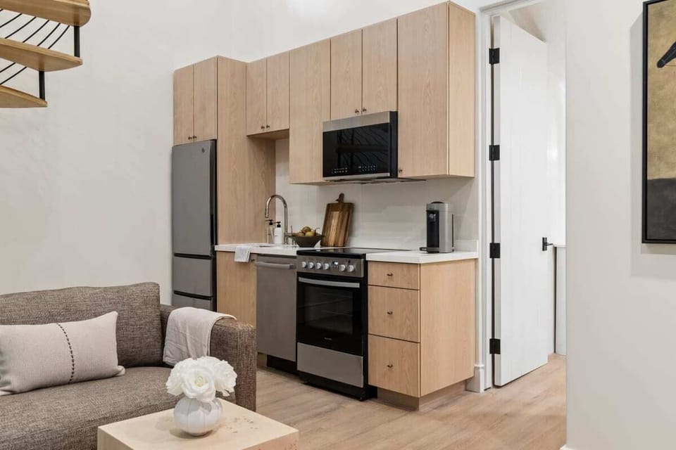 Full kitchen: Nespresso, fridge, stove/oven, plates and utensils, dishwasher