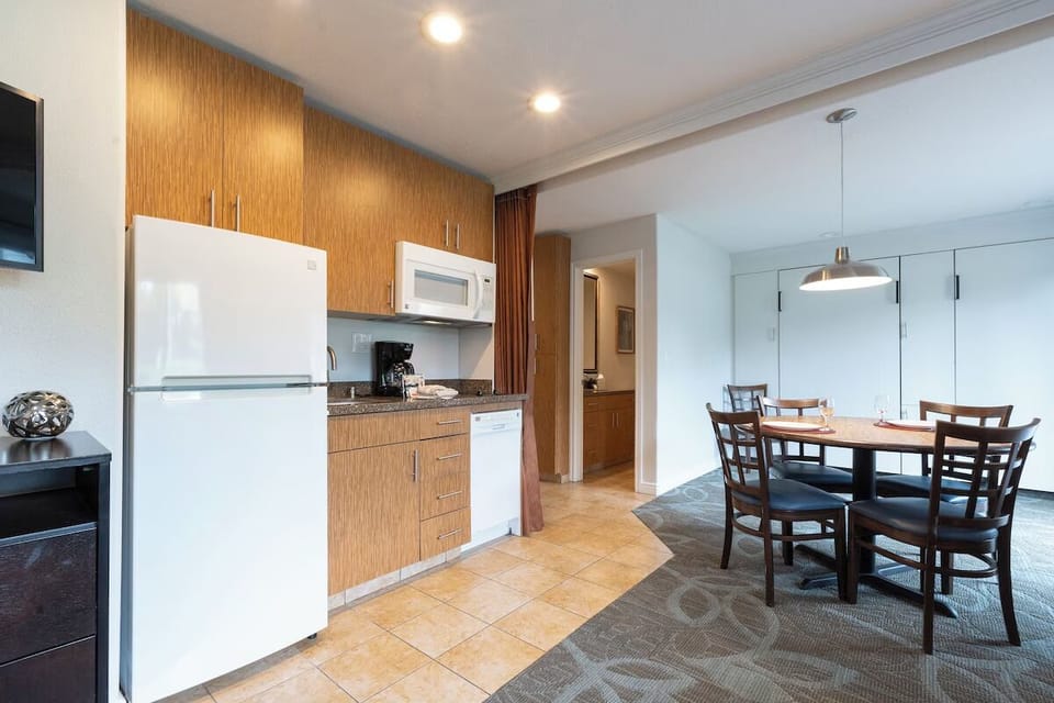 Enjoy casual dinners at the table just steps from the kitchen