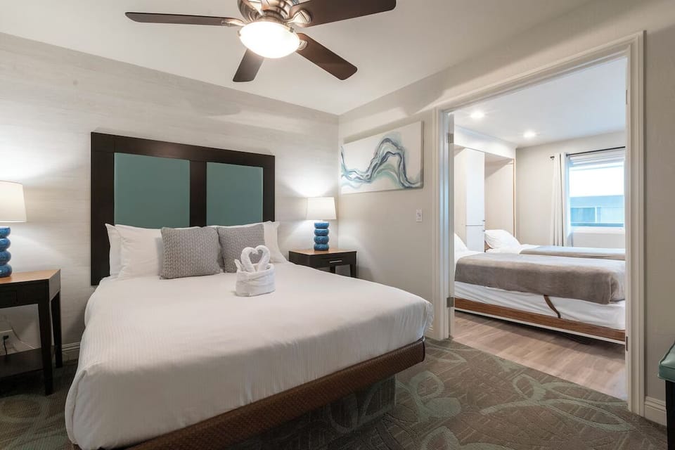 Drift off comfortably in a serene bedroom with soft lighting.