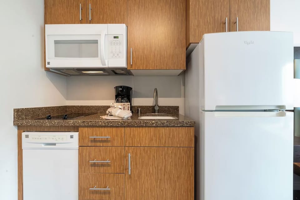 Prep easy meals with full fridge, microwave, and sink.