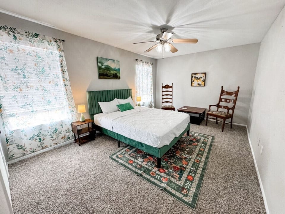 Bright and airy bedroom with stylish touches and cozy linens.