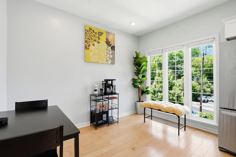 Enjoy a bright and airy dining space filled with natural light, complete with a cozy coffee station and beautiful Midtown views that create the perfect start to your mornings.