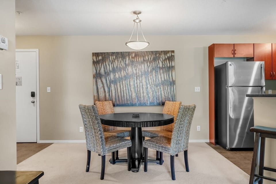 Dining area with seating for 4 at the table and 2 at the island.