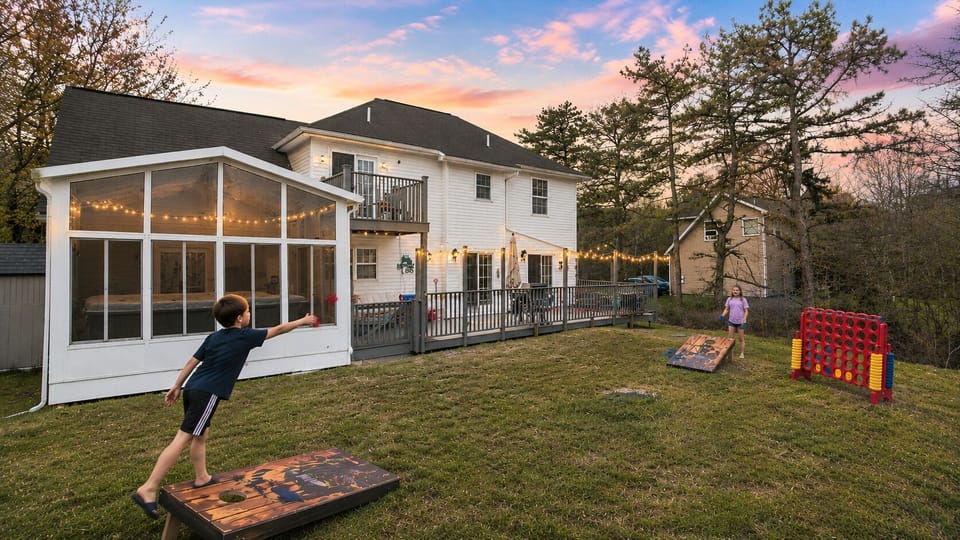 Gather the family for cornhole, giant Connect 4, and backyard laughs during beautiful Pocono summer sunsets.