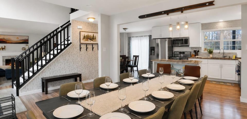Gather around the dining table for a fun filled relaxing family dinner with room for the little one at the end with the high chair