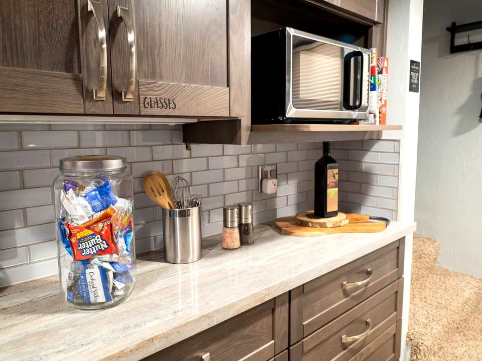 Kitchen: Delight in a stylish space with gourmet snacks, modern appliances, and ample prep room!