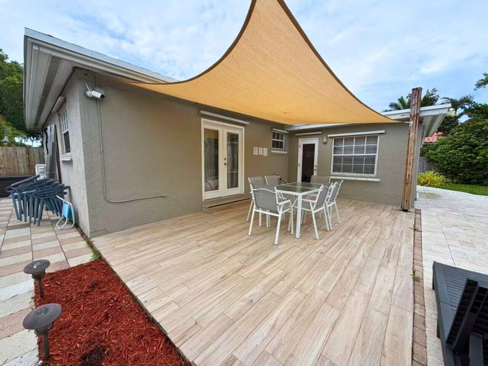 Private backyard with table and chairs