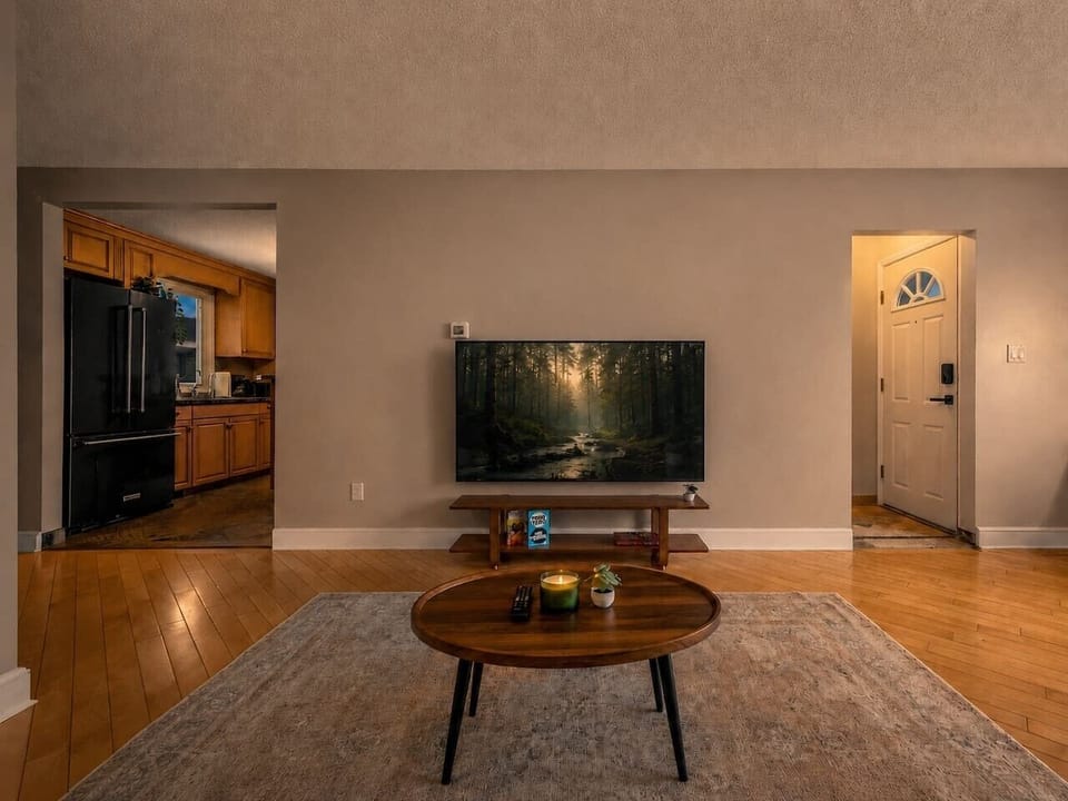 Open living room with flat-screen TV and ample seating space