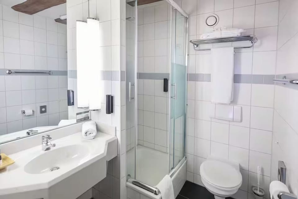 Step into a spotless bathroom with everything within easy reach.