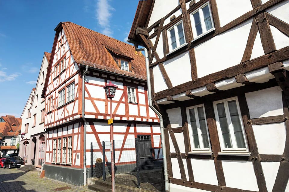 Explore the quaint surrounding streets with classic timbered architecture.