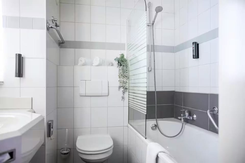 Rejuvenate with a clean, modern bath and shower combo.