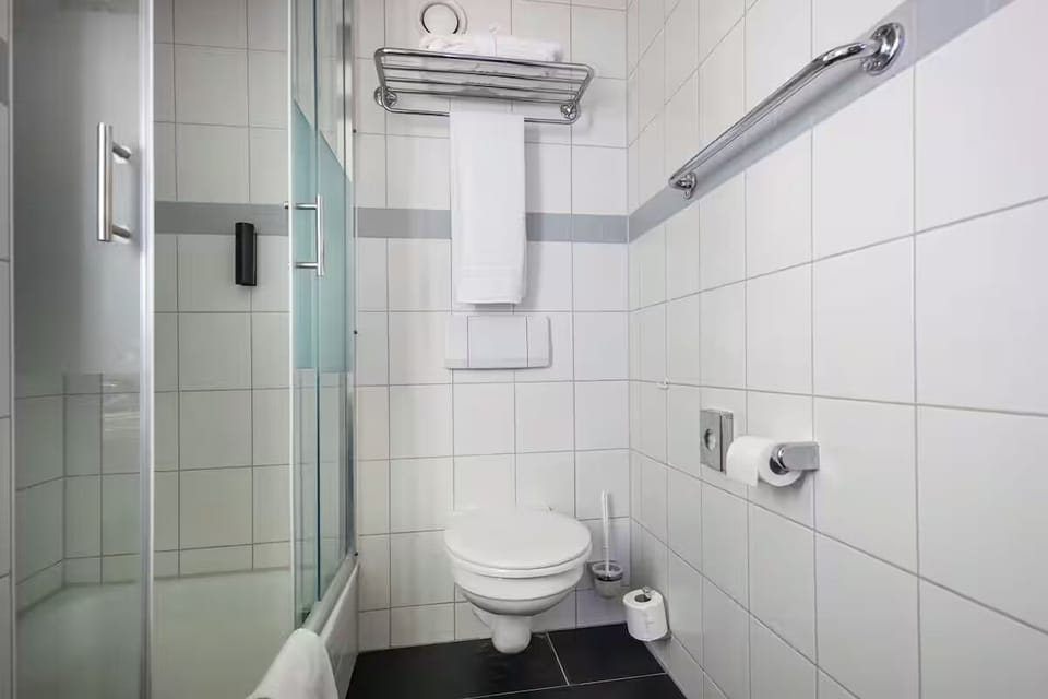Start your day fresh in a spotless, well-lit bathroom.