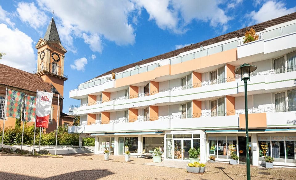 Enter effortlessly through the bright lobby doors after exploring town.