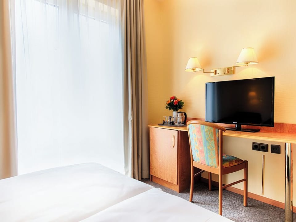 Catch up on emails comfortably at the in-room desk.