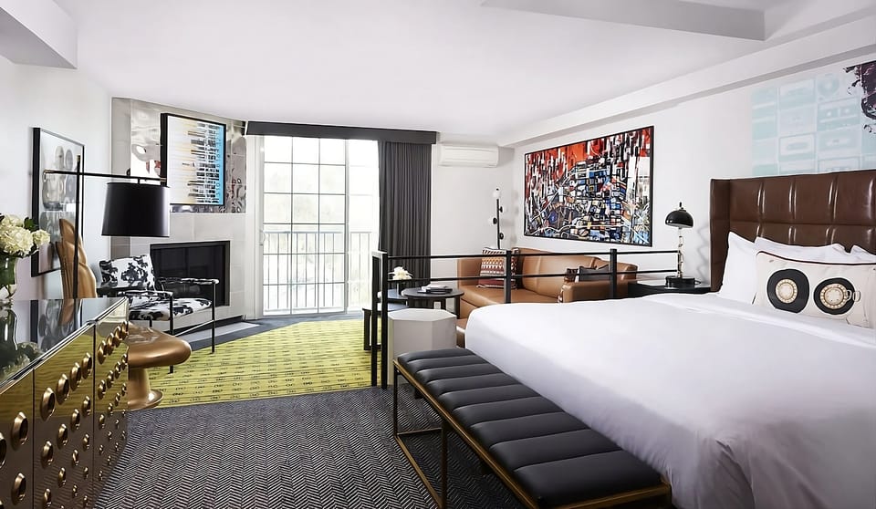 Sink into crisp linens in a bright, designer suite retreat.