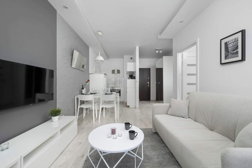 Stylish living room with a TV area, modern furniture, and a spacious layout.