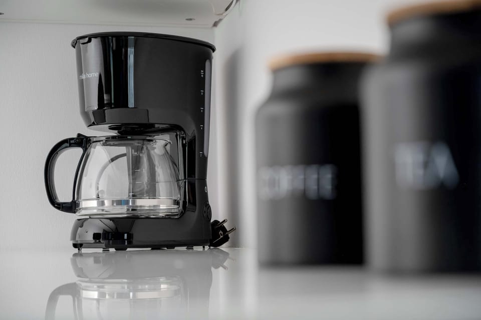 Coffee machine and complimentary coffee setup for a perfect morning start.