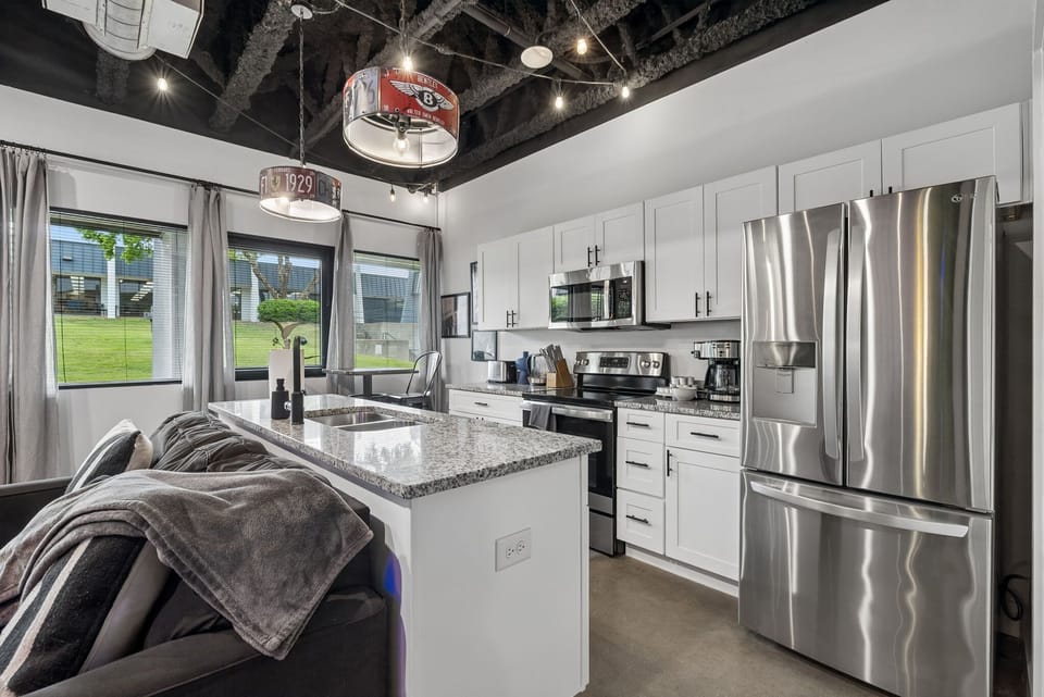 Kitchen: A fully equipped kitchen with full-size appliances — stove, oven, microwave, fridge, and drip coffee to start the day right.