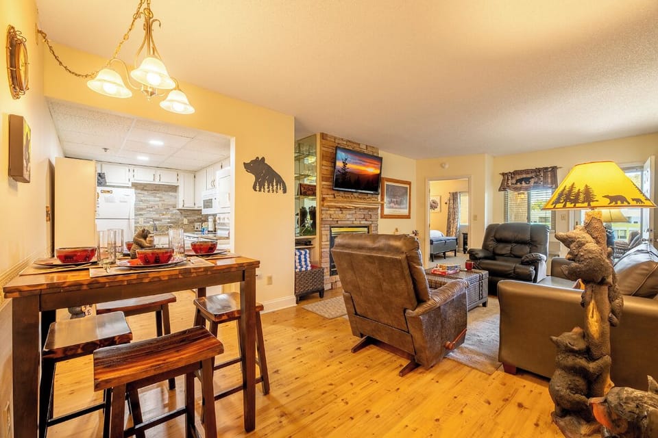 Step into a warm and inviting space where rustic charm meets relaxation. Enjoy cozy seating, a welcoming dining area, and a mountain-themed ambiance designed for your comfort.