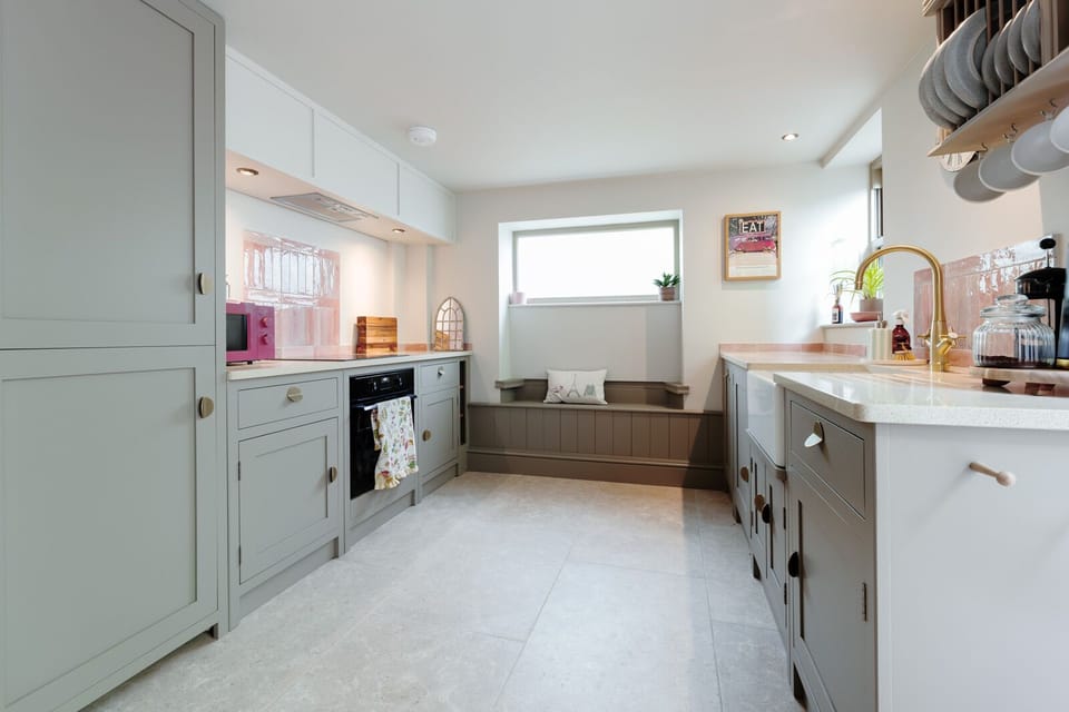 A fully equipped kitchen includes a dishwasher and washing machine for your convenience