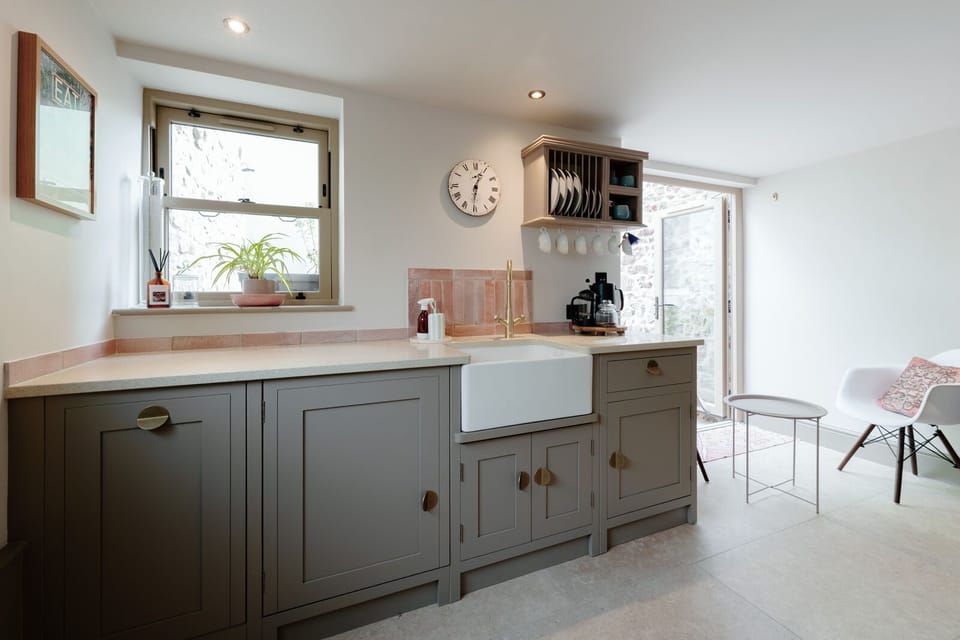 A fully equipped kitchen includes a dishwasher and washing machine for your convenience