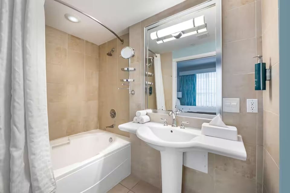 Indulge in a sparkling bath with bright, hotel-style lighting.